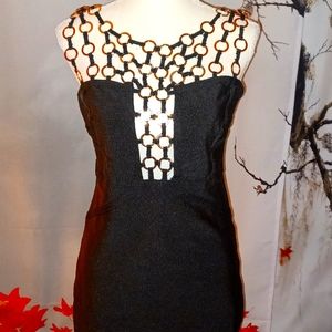 Black dress with gold circular compliments.